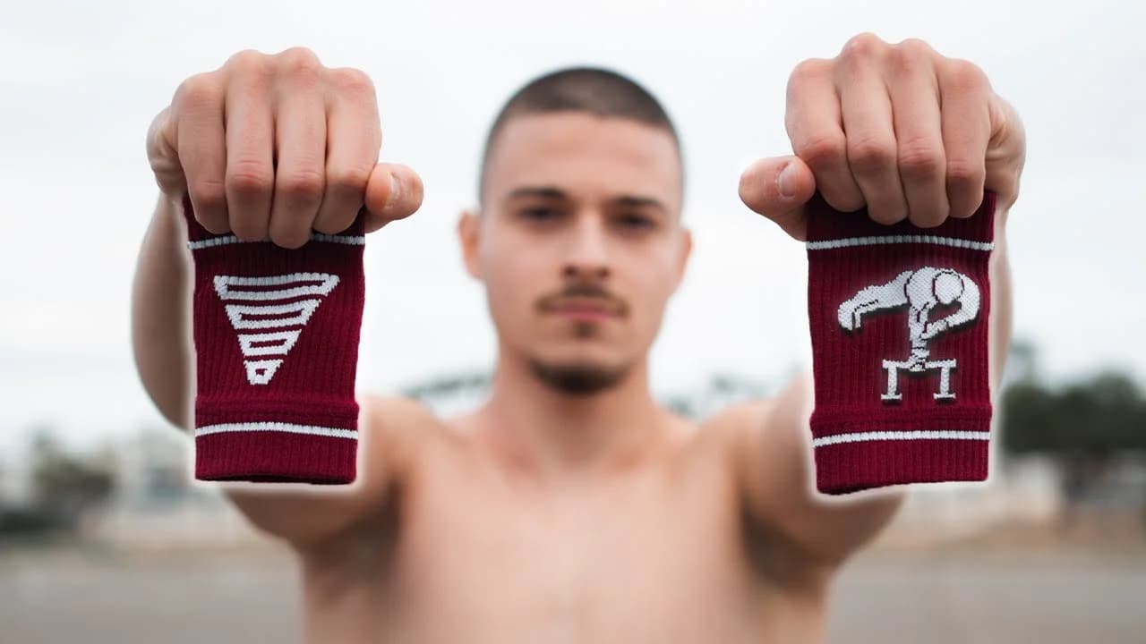Daniel Hristov holding the white and red Hristov x GORNATION Cru Edition wristbands after opening the package