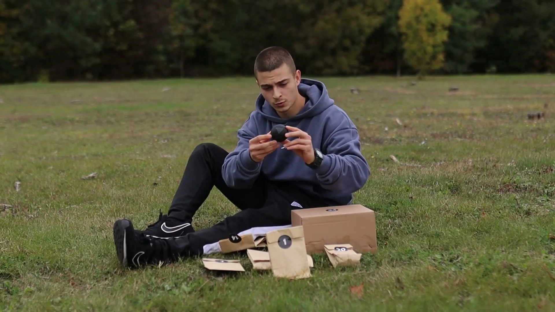 Daniel Hristov holding a small black massage ball from box 14 of the GorNation advent calendar