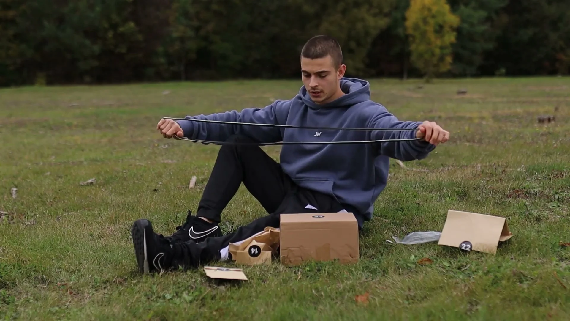 Daniel Hristov stretching out a long black resistance band from box 22 of the GorNation advent calendar